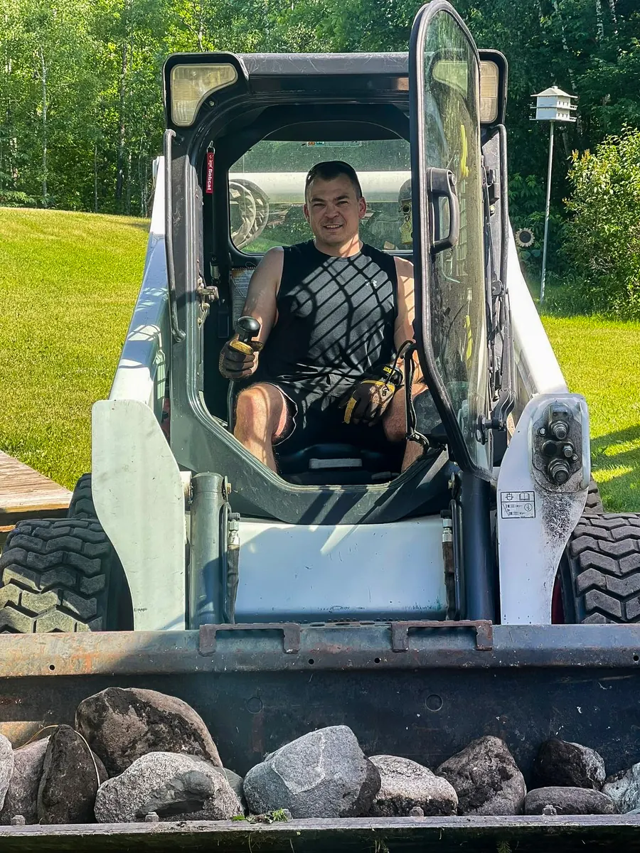 Chris Westlund operating a Bobcat S650 skid steer