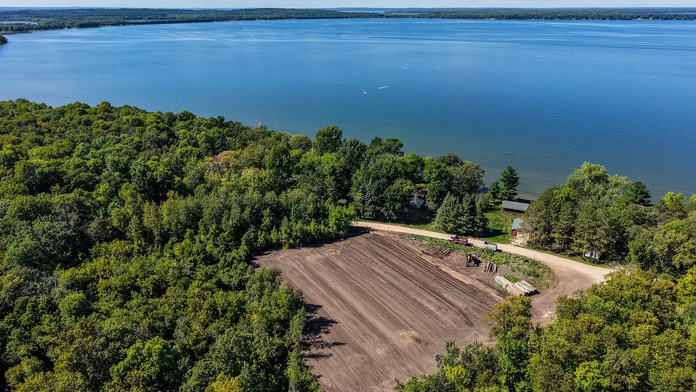 Aerial view of a lakeshore lot being graded by Shepard Excavating