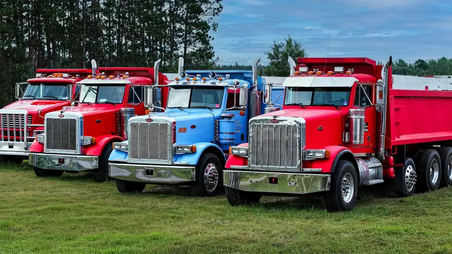 Storlie Construction dump trucks lined up in the yard